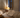 Calm European bedroom at night with soft breathable bedding, a sleeper under a light duvet and a thermostat showing a cool 18°C setting.