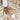 Hand stroking the cream Sand faux fur throw blanket with FSC and OEKO-TEX certification logos.