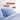 Light Blue SJUMO organic cotton duvet cover and pillowcases on a bed: temperature-regulating, hypoallergenic and natural.