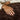 Hand resting on the soft dark brown faux fur of the SJUMO Plaid in Cacao Cloud