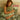 Woman hugging a Sage Green SJUMO Tencel Sateen pillow, silky soft and gentle on your skin.