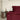 Burgundy SJUMO Silky Smooth duvet cover and pillowcases beside a dark wooden bedside table