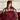 Woman in checked pyjamas wearing a burgundy SJUMO sleep mask under a Silky Smooth duvet cover in Burgundy
