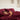 Woman sleeping on SJUMO Silky Smooth pillowcases under a matching duvet cover in Burgundy