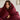 Woman wrapped in a warm SJUMO Silky Smooth duvet cover in Burgundy with eyes closed