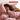 Woman sleeping under a Soft Pink SJUMO Tencel Sateen duvet cover, naturally cool and lightweight.